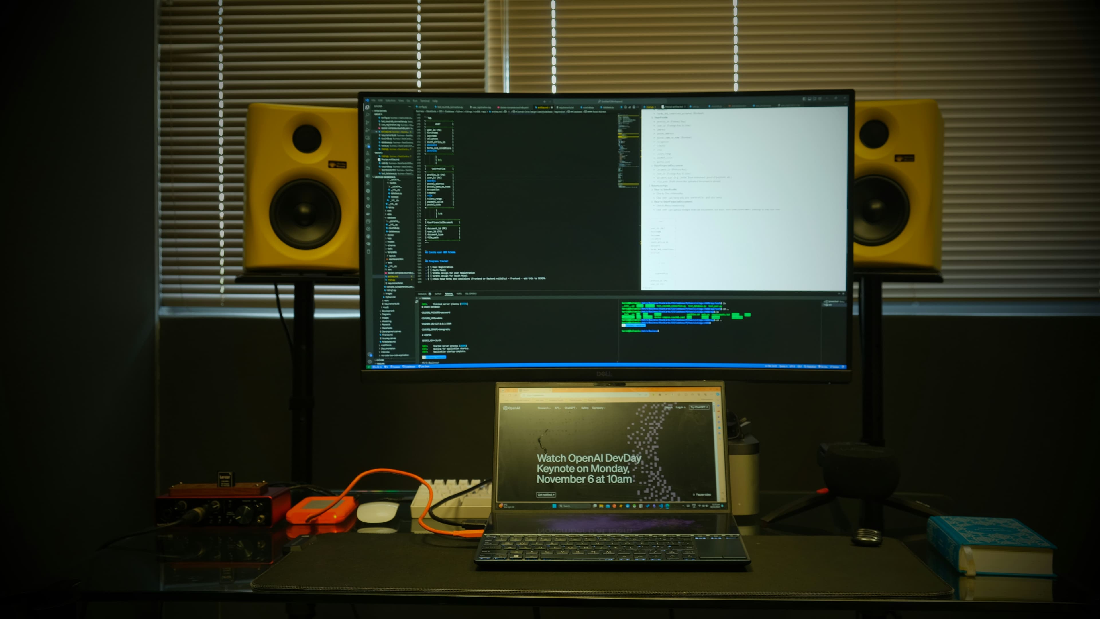 Modern web development workspace with code on multiple screens